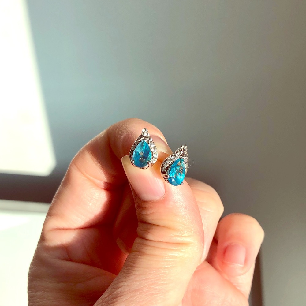 Blue topaz earrings with white topaz stones.